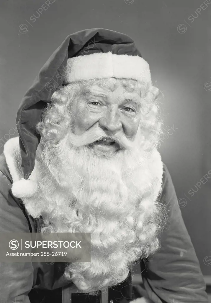 Vintage photograph. Man in Santa Claus costume smiling