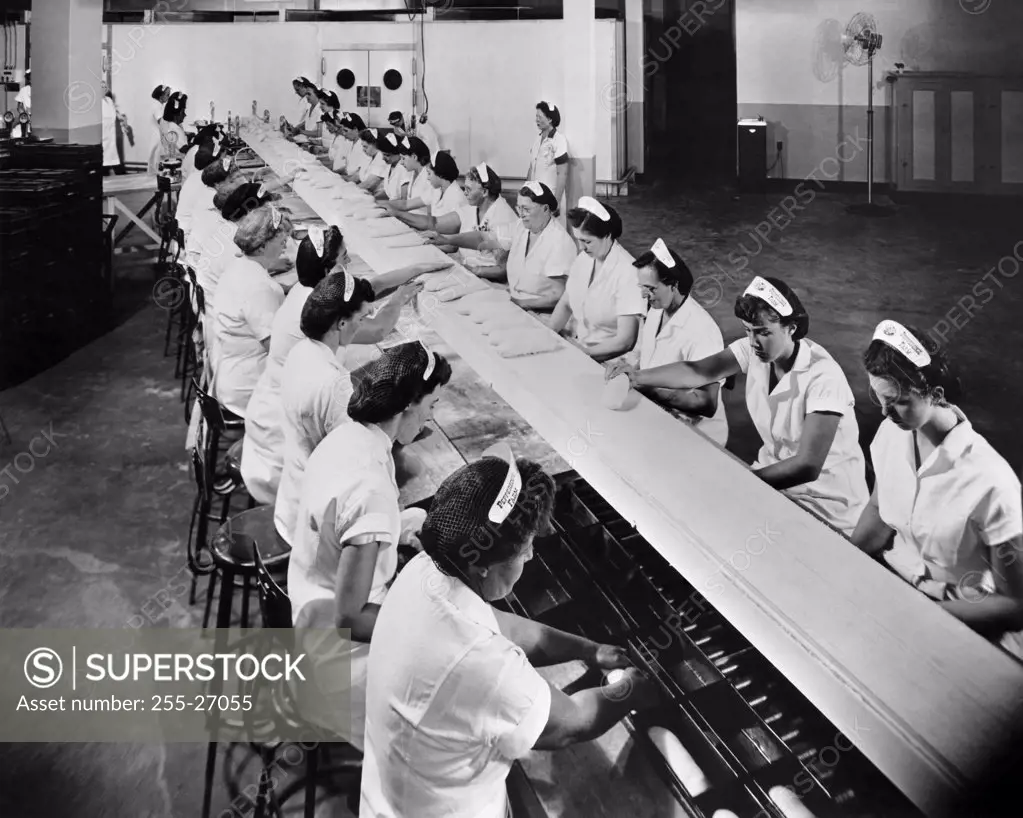 High angle view of a group of female workers working in a bread factory