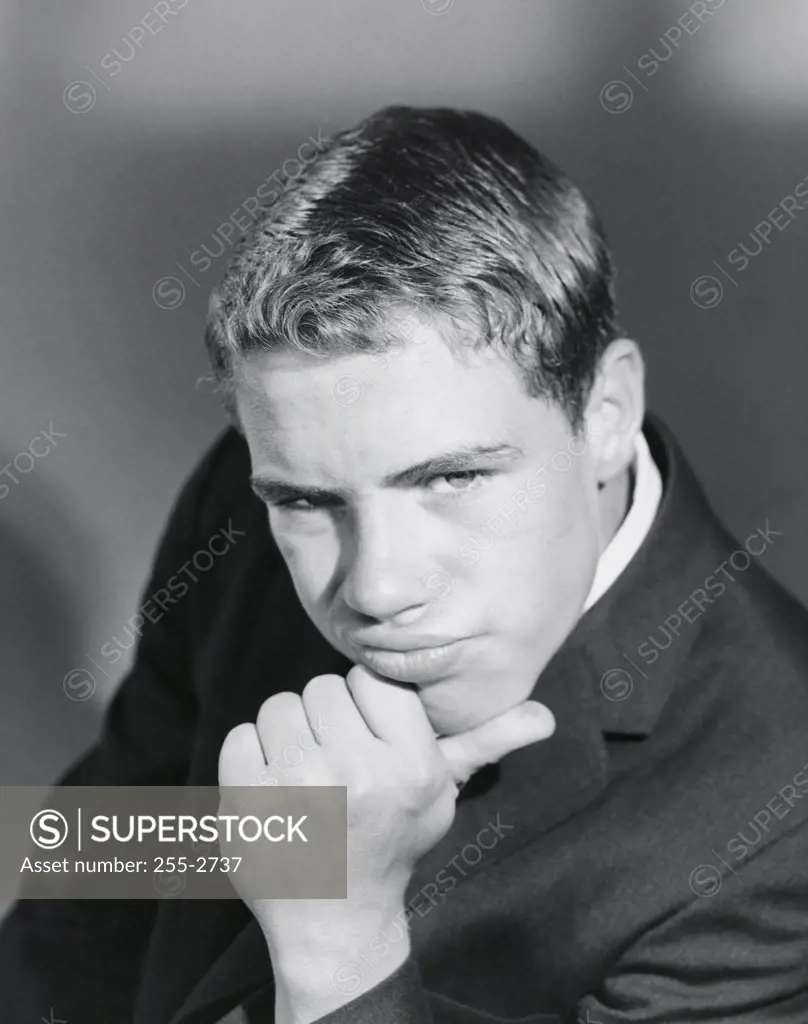 Portrait of a teenage boy thinking
