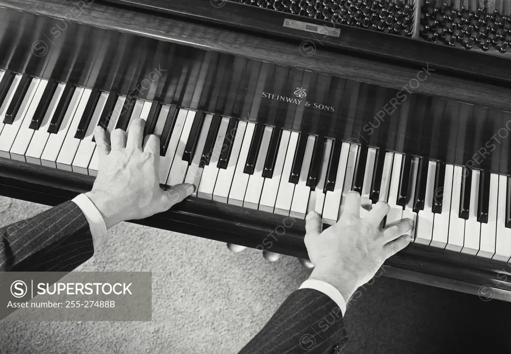 Vintage Photograph. Male hands playing Steinway & Sons grand piano