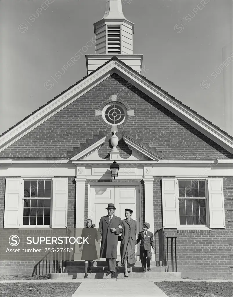 Vintage Photograph. Well dressed family of four walking away from steps of small church Frame 1