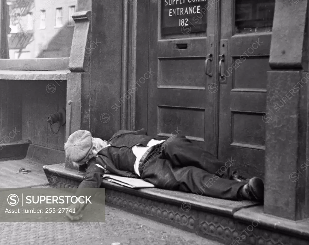 Man sleeping on the doorstep, Bowery, Manhattan, New York City, New York State, USA
