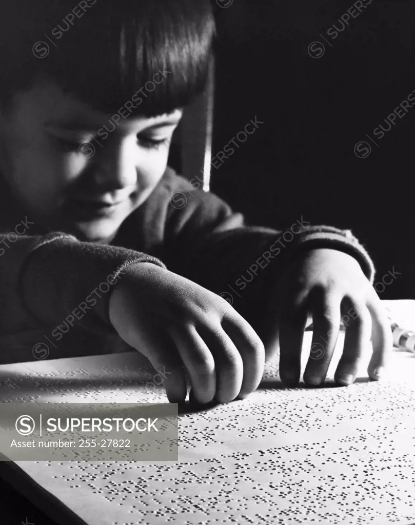 Blind boy reading Braille
