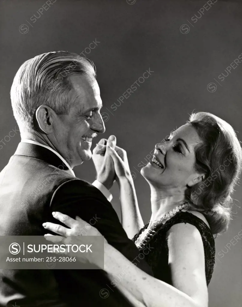 Side profile of a senior couple dancing