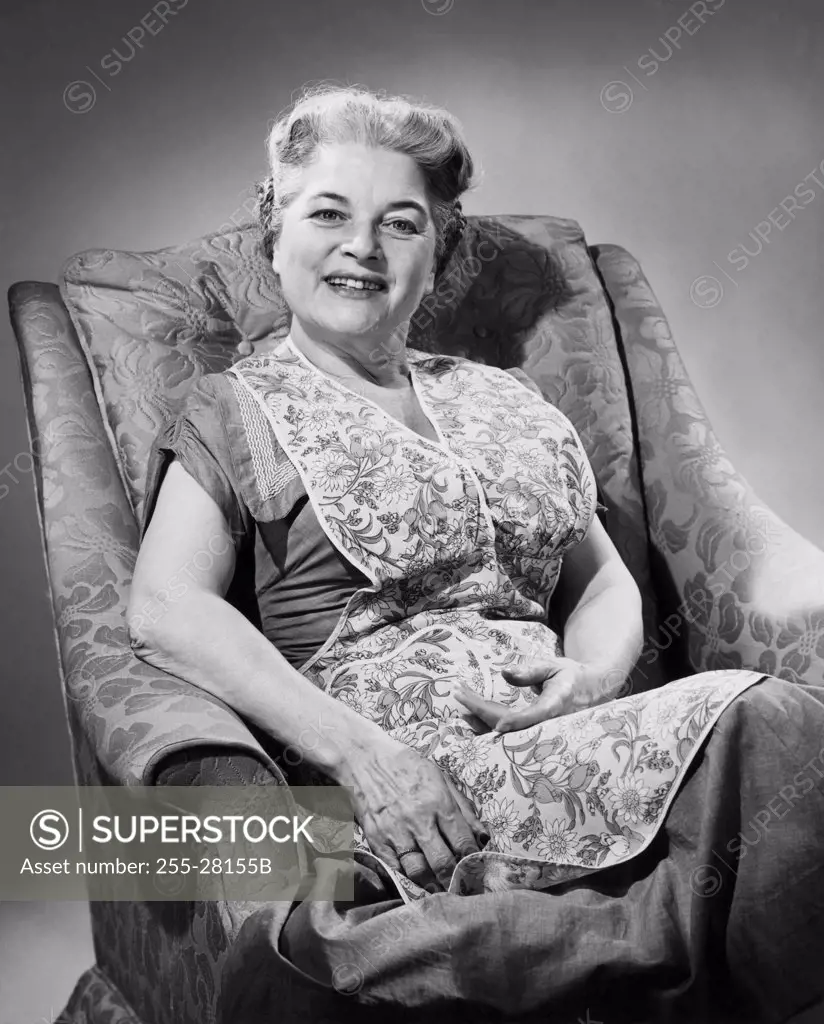 Portrait of a senior woman sitting on an armchair