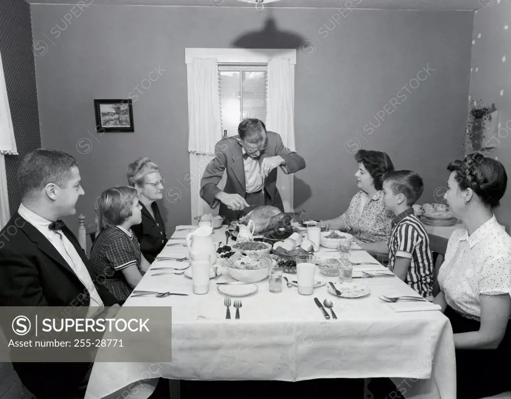 Family at a dining table on Thanksgiving Day