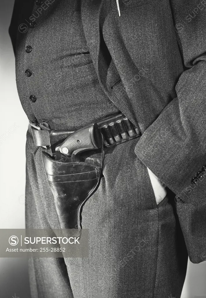 Vintage Photograph. Mid section view of a person wearing a gun holster