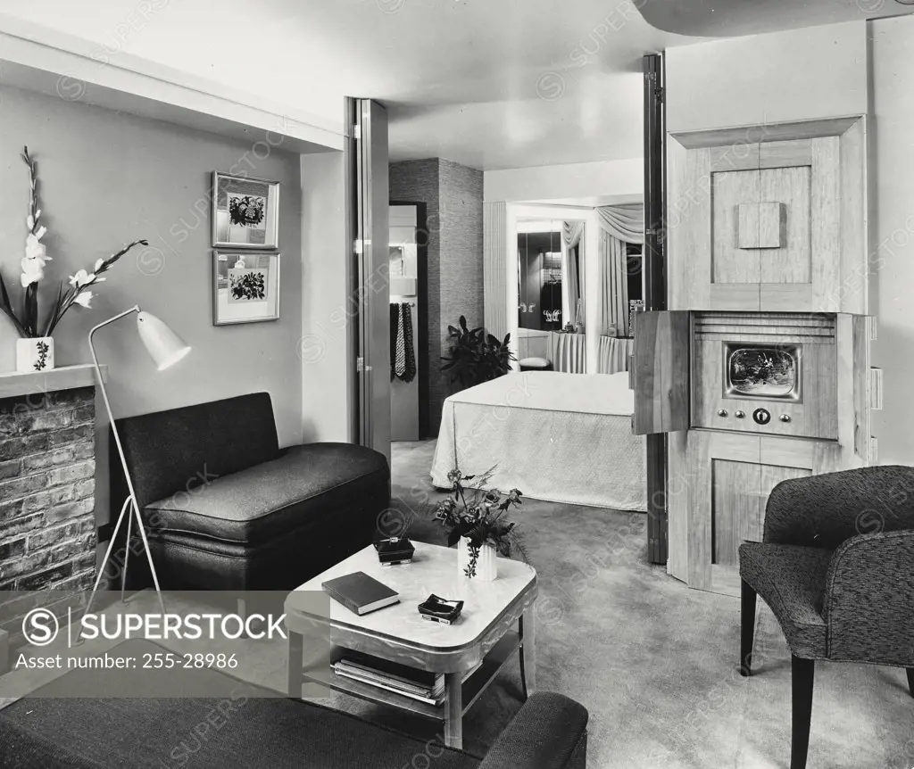 Vintage photograph. Master bedroom with adjoining television, sitting room