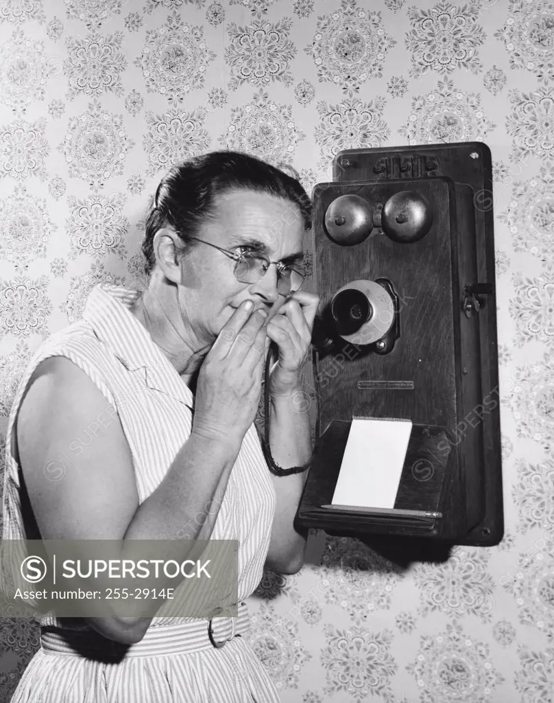 Side profile of a senior woman talking on the telephone