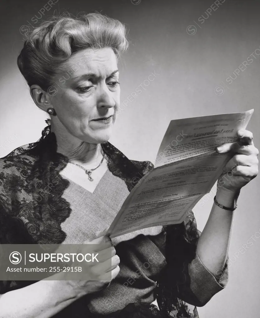 Senior woman reading a document