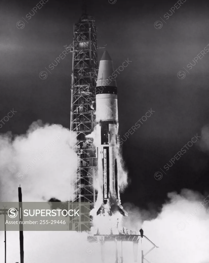 Apollo rocket taking off from a launch pad