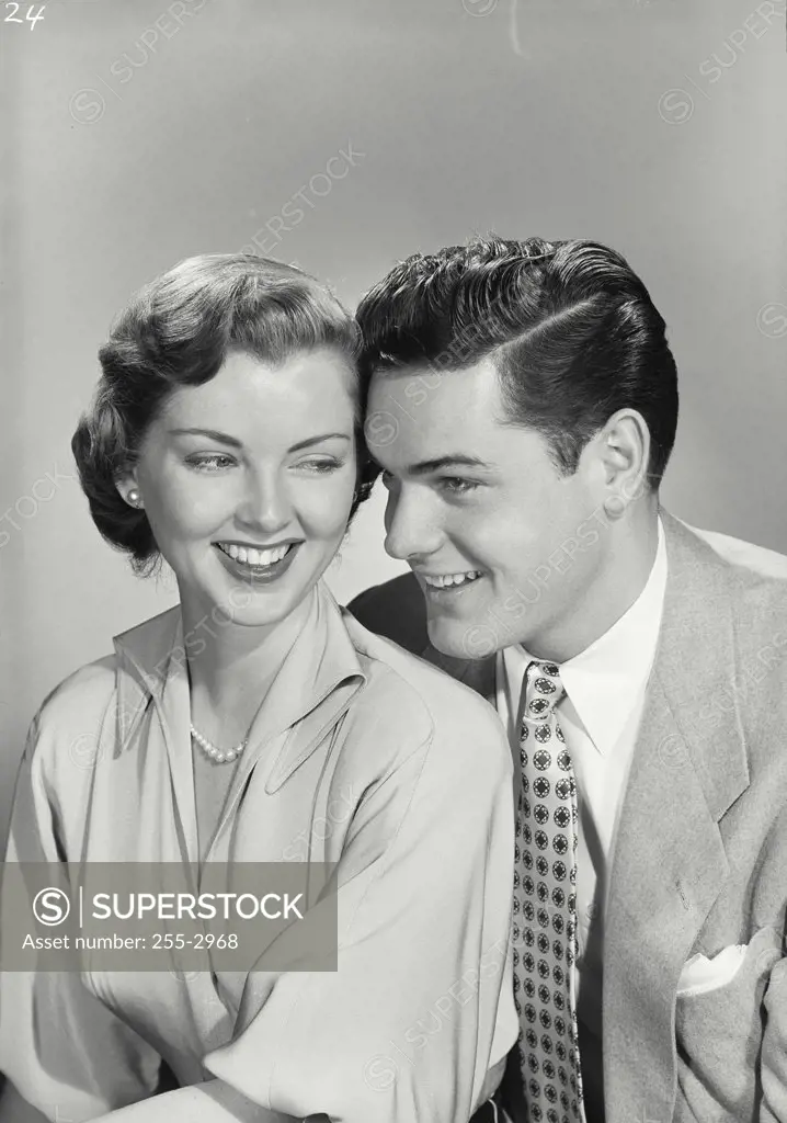 Vintage photograph. Close-up of young couple smiling together.