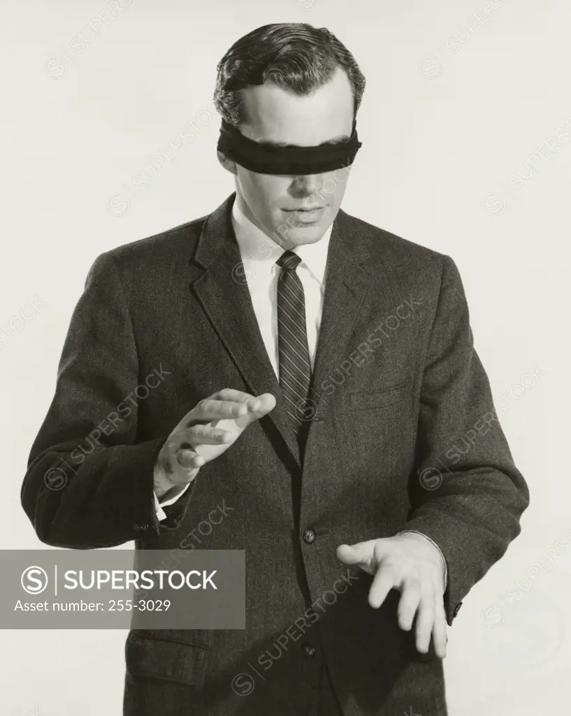 Close-up of a businessman with his eyes blindfolded