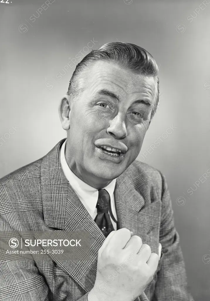 Vintage photograph. Portrait of Businessman with comical expression.