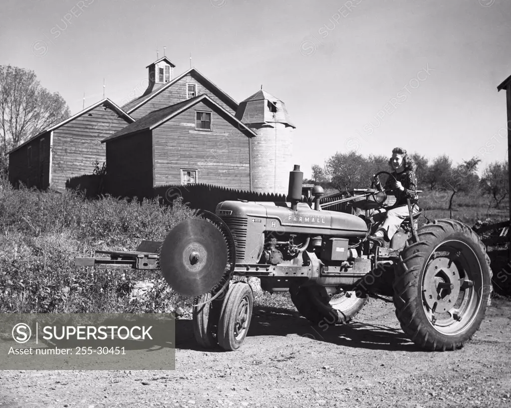 Woman sitting on a tractor