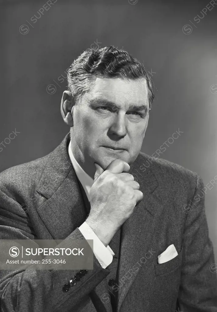 Vintage Photograph. Close-up of a mature man with his hand on his chin