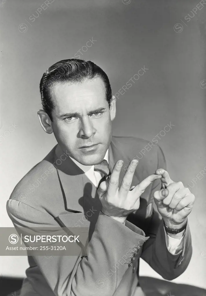 Vintage photograph. Portrait of a businessman counting on his fingers
