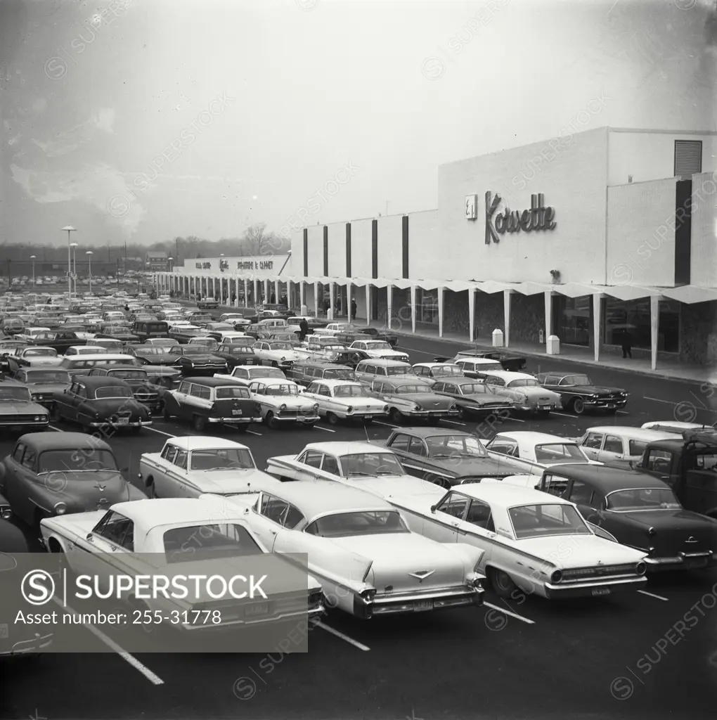 Vintage Photograph. Cars in a parking lot of a shopping center