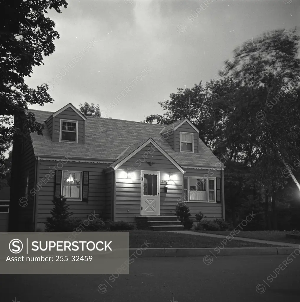 Vintage Photograph. Neighborhood house seen at night. Frame 2