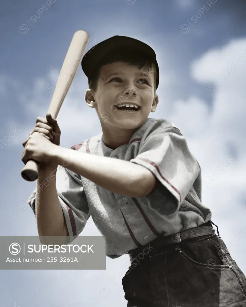 Young boy with baseball bat waiting for pitch