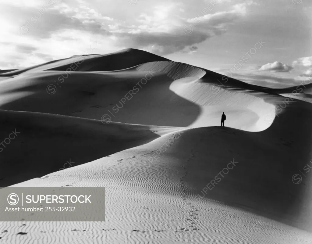 USA, California, Person on sand dunes in desert