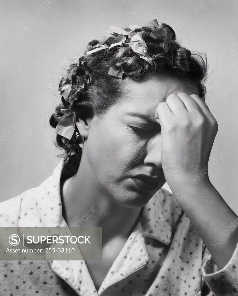 Close-up of a mid adult woman suffering from a headache