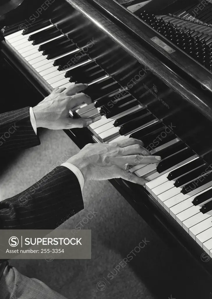 Vintage Photograph. Male hands playing a piano