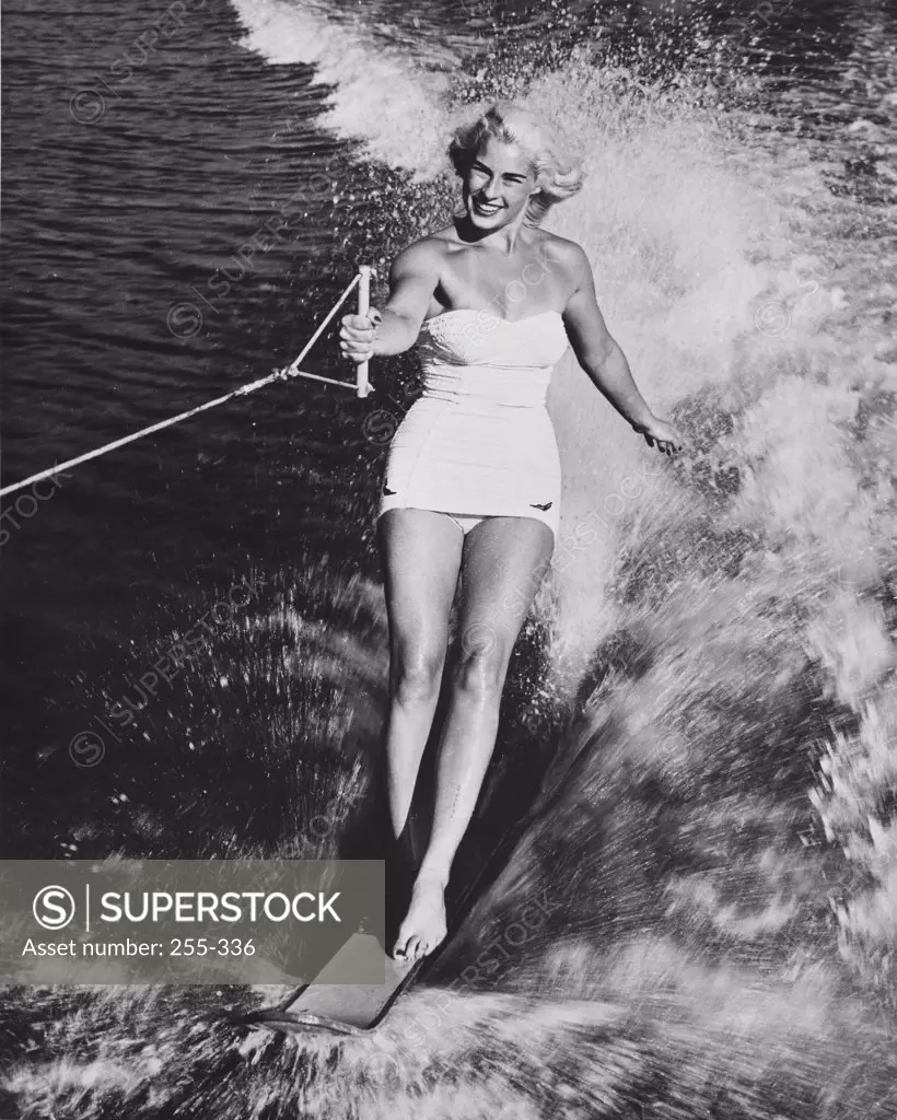 Young woman water skiing