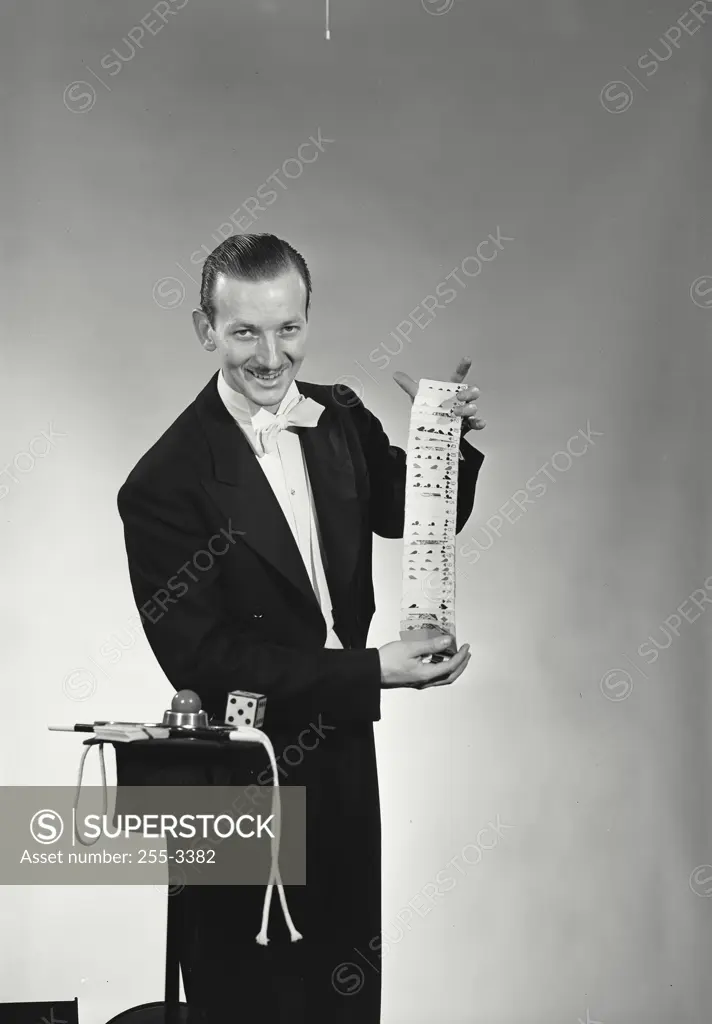 Vintage Photograph. Portrait of a magician performing card tricks