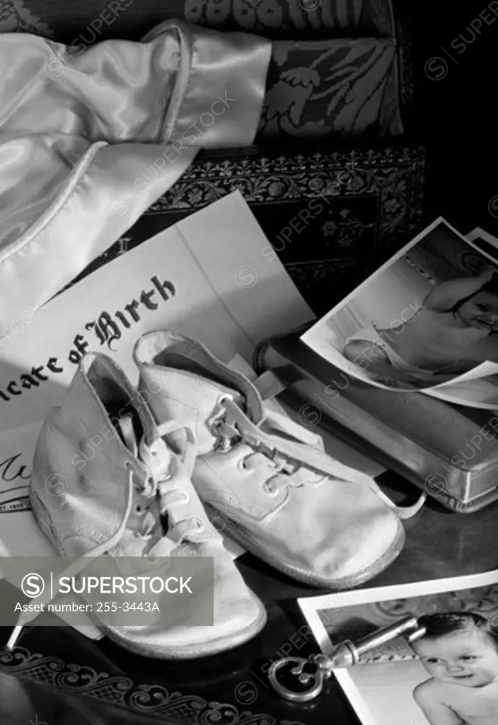 Shoes on baby photos and birth certificate
