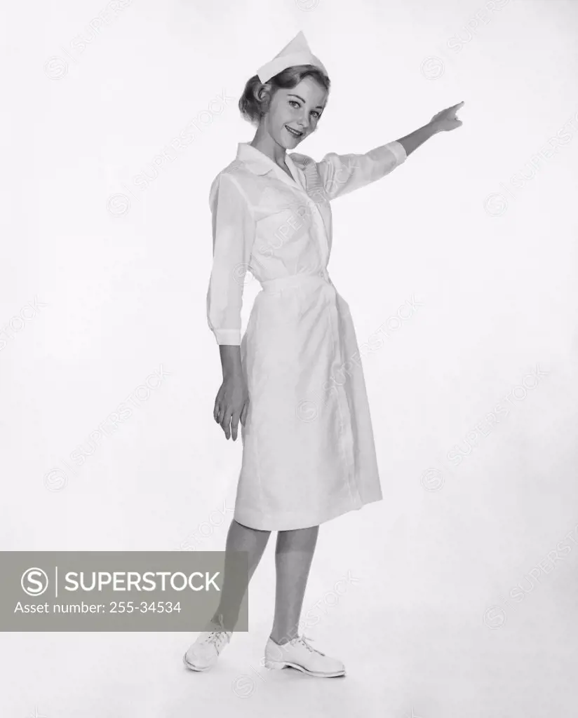 Portrait of a female nurse pointing with her finger