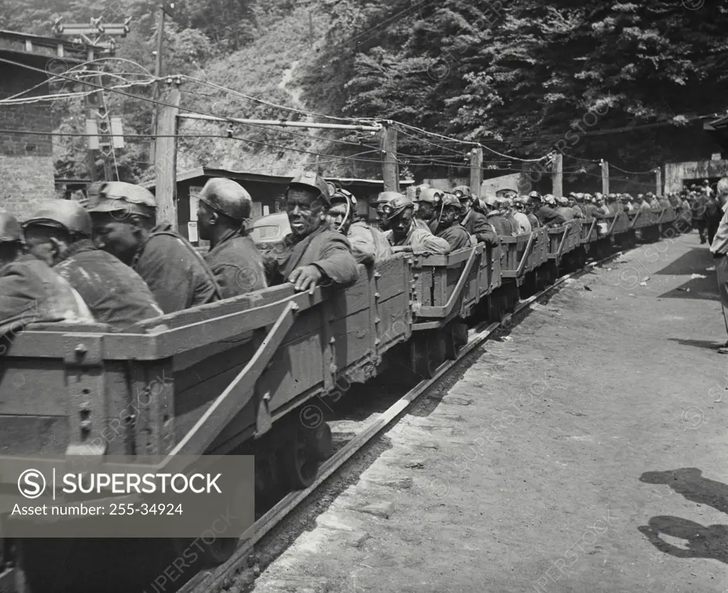 Vintage Photograph. Man trip, going down into mine to work their shift