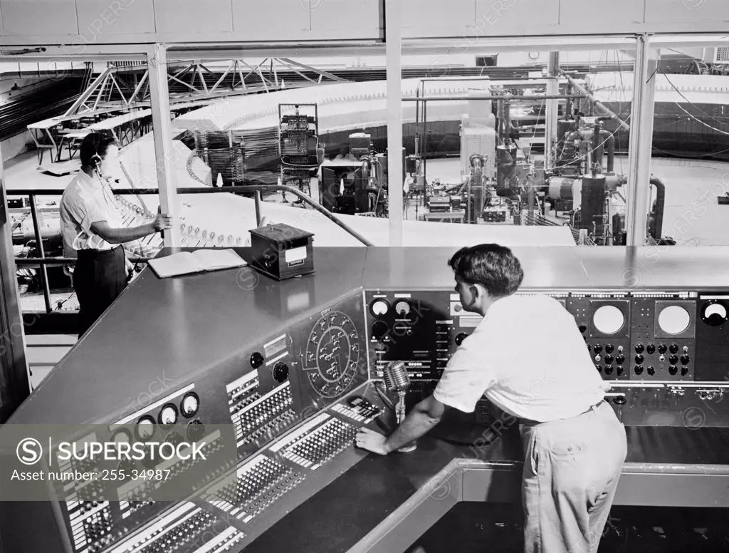 High angle view of scientists working in a control room of a laboratory, Brookhaven National Laboratory, Upton, Long Island, New York State, USA