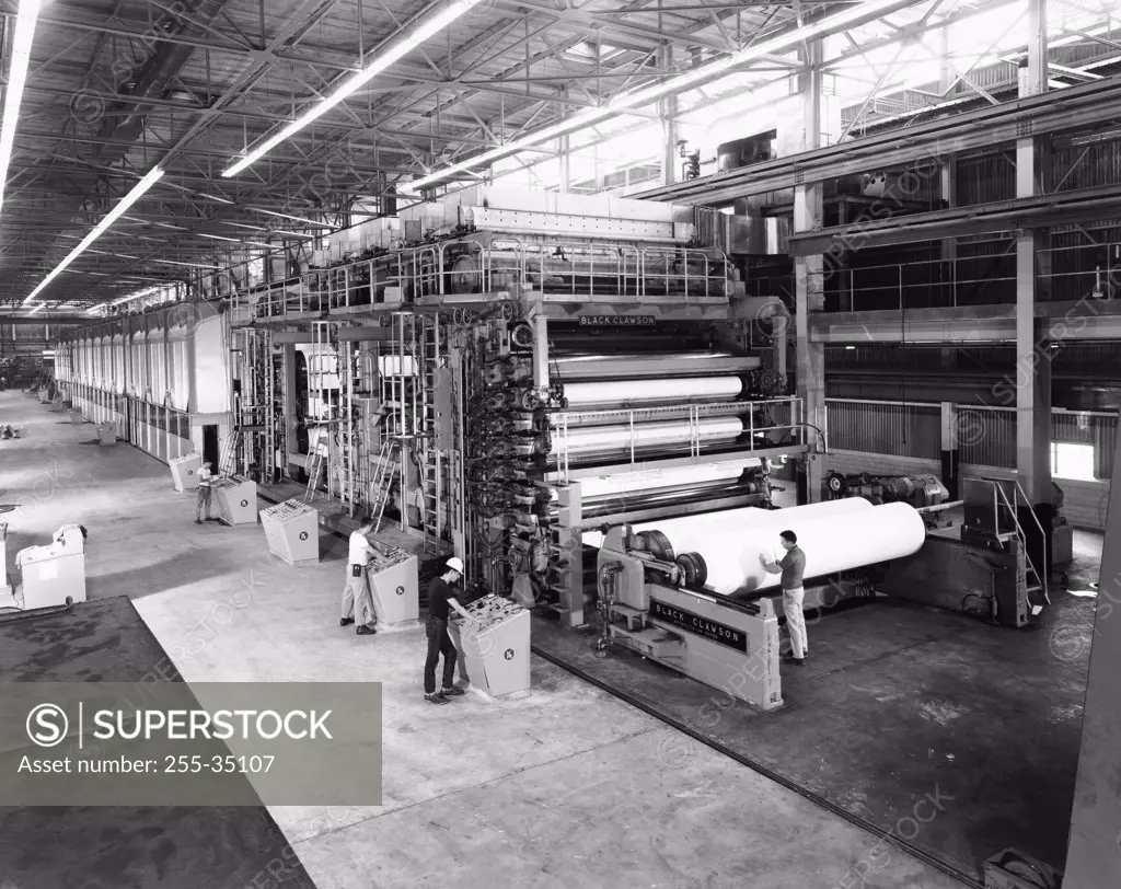 Four people working in a paper mill, Augusta, Georgia, USA