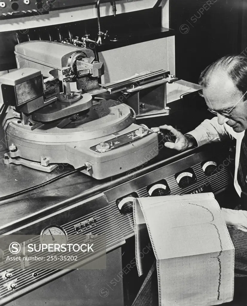 Vintage photograph. Machine makes it possible to determine in a few minutes the chemical contents and arrangement of atoms in a chemical sample