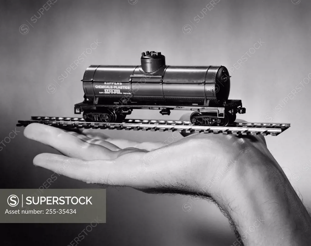 Hand holding toy train