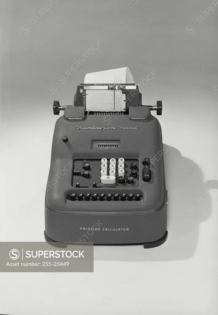 Vintage Photograph. Remington Rand printing calculator on photo paper background, straight on view