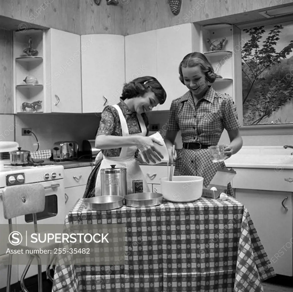 Two young women cooking