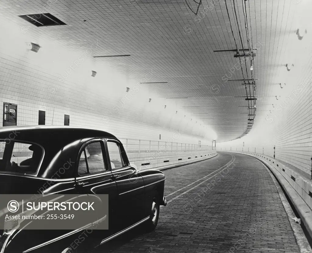 Vintage photograph. Close-up of a car moving through the Brooklyn battery Tunnel