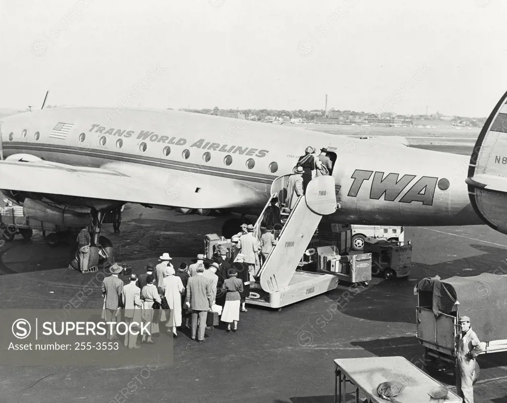 Vintage photograph. People boarding constellation airliner of Trans world airlines