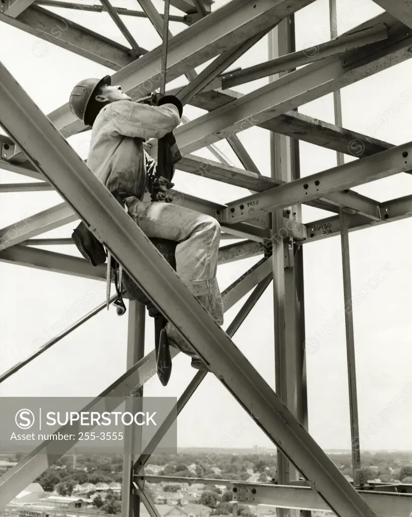 Low angle view of a construction worker in a harness, New Orleans, Louisiana, USA