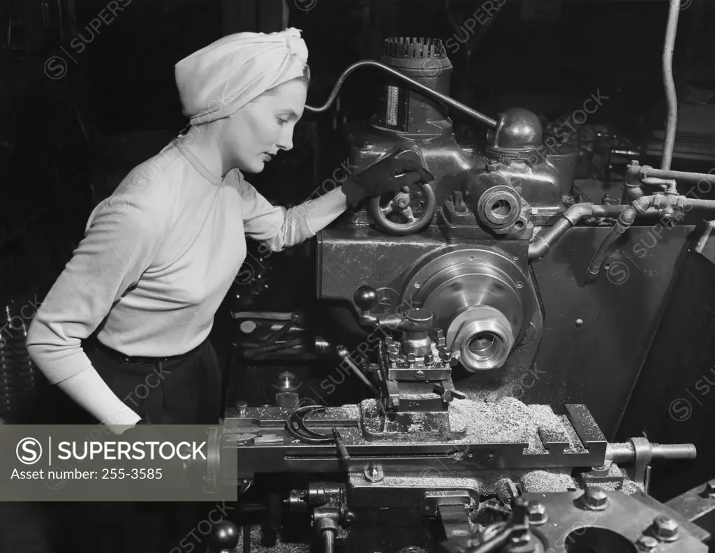 Side profile of a female worker working in a factory