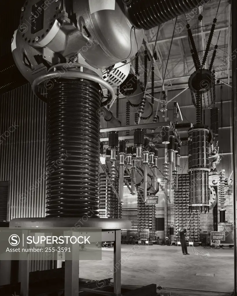 Two engineers working with tuning reactors, General Electric, Philadelphia, Pennsylvania, USA
