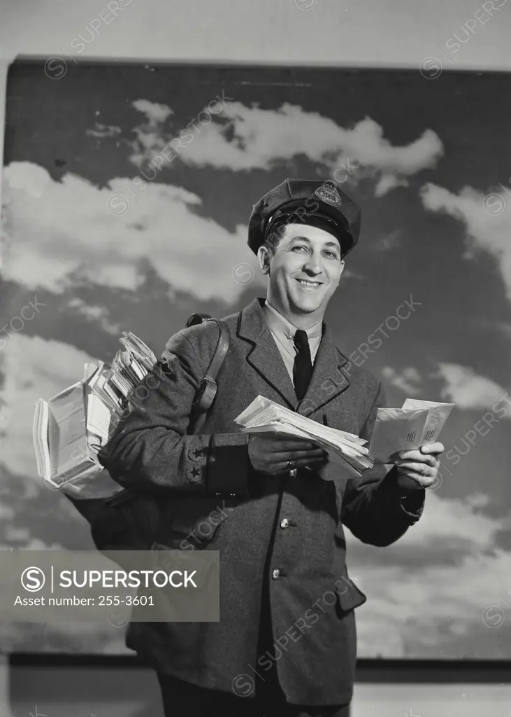 Vintage Photograph. Mailman holding bag of mail and a letter. Frame 2
