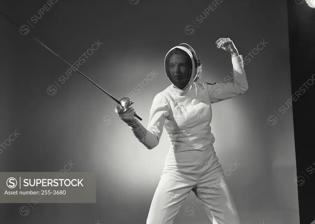 Vintage Photograph. Woman in fencing gear holding out saber in fighting stance. Frame 3