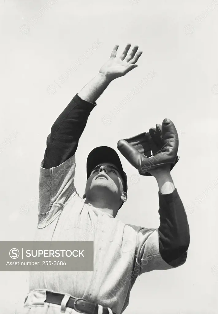 Vintage photograph. Baseball player waiting to catch ball in mitt