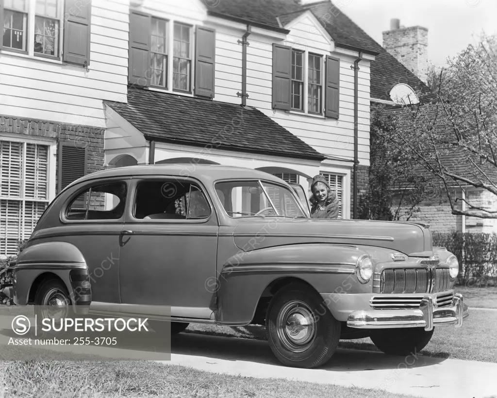 Car parked in front of a house, 1946 Mercury Coupe