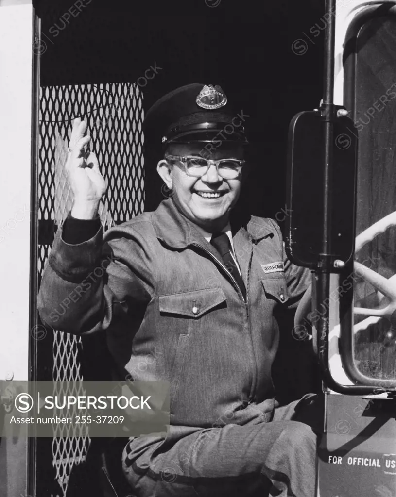Portrait of a truck driver waving his hand