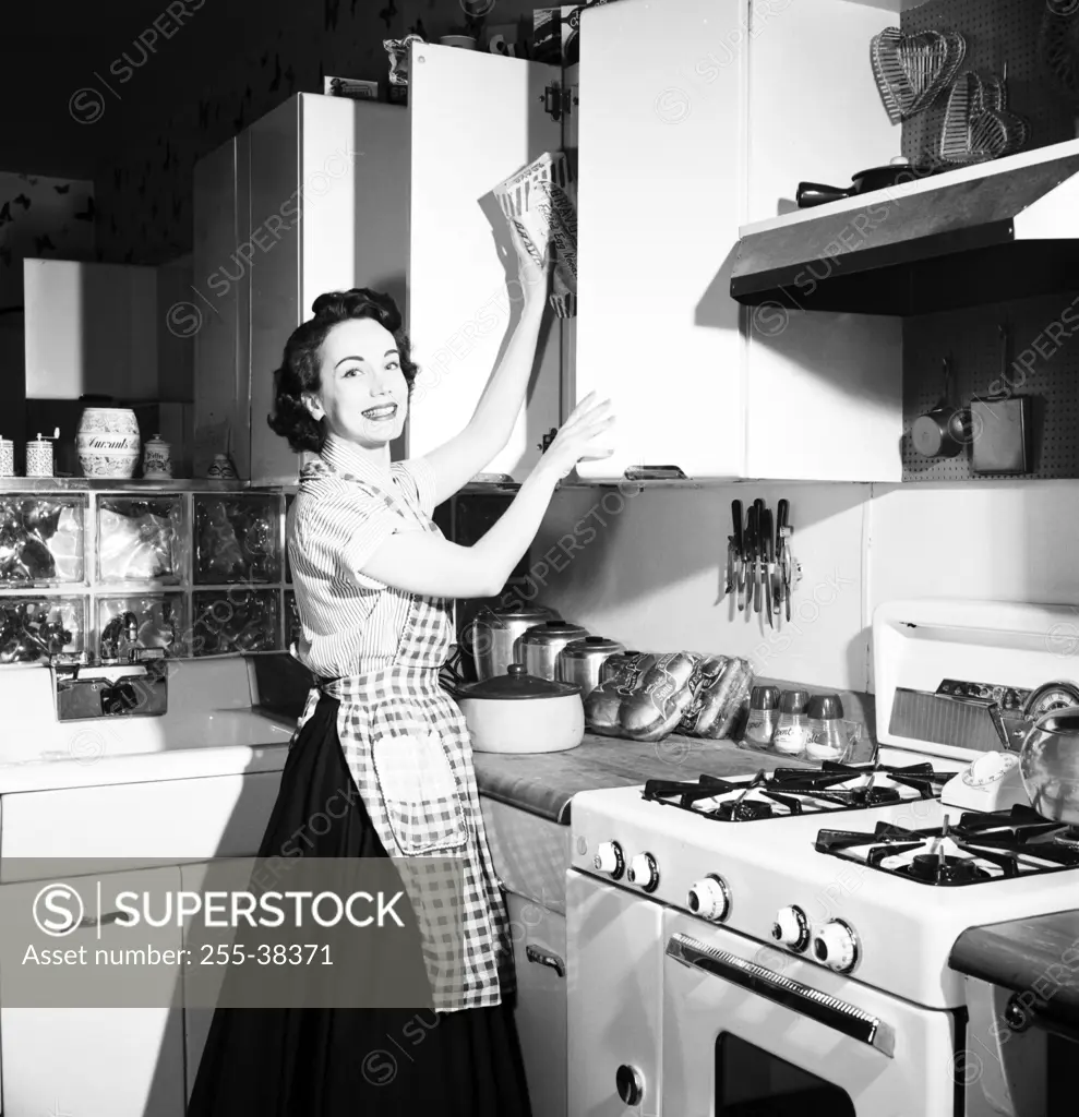 Portrait of a young woman working in a kitchen