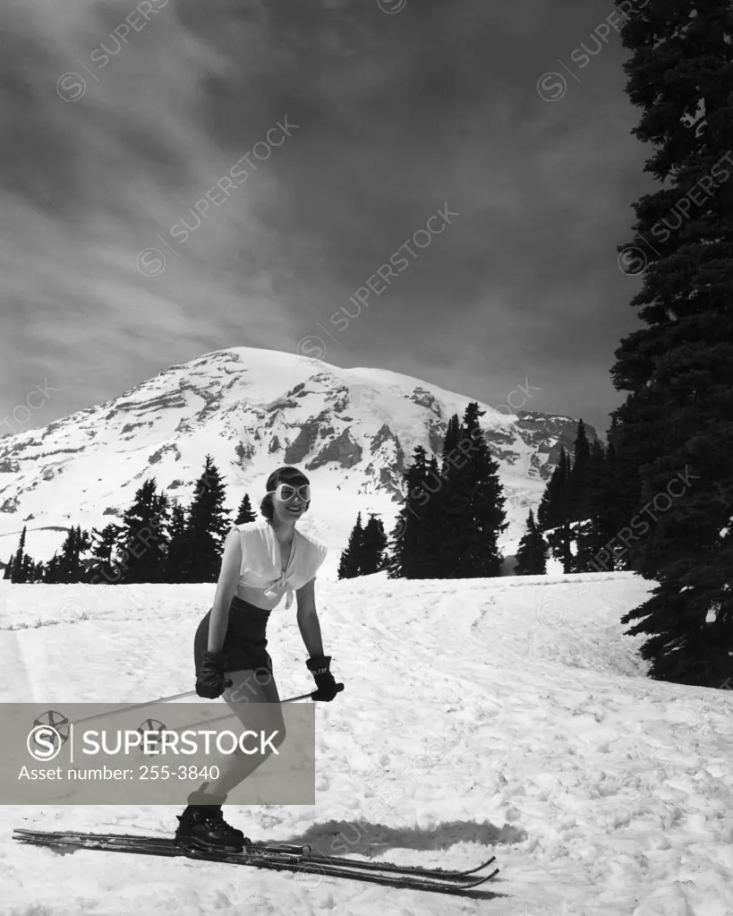 Woman skiing on snow, Mt Rainier National Park, Washington State, USA